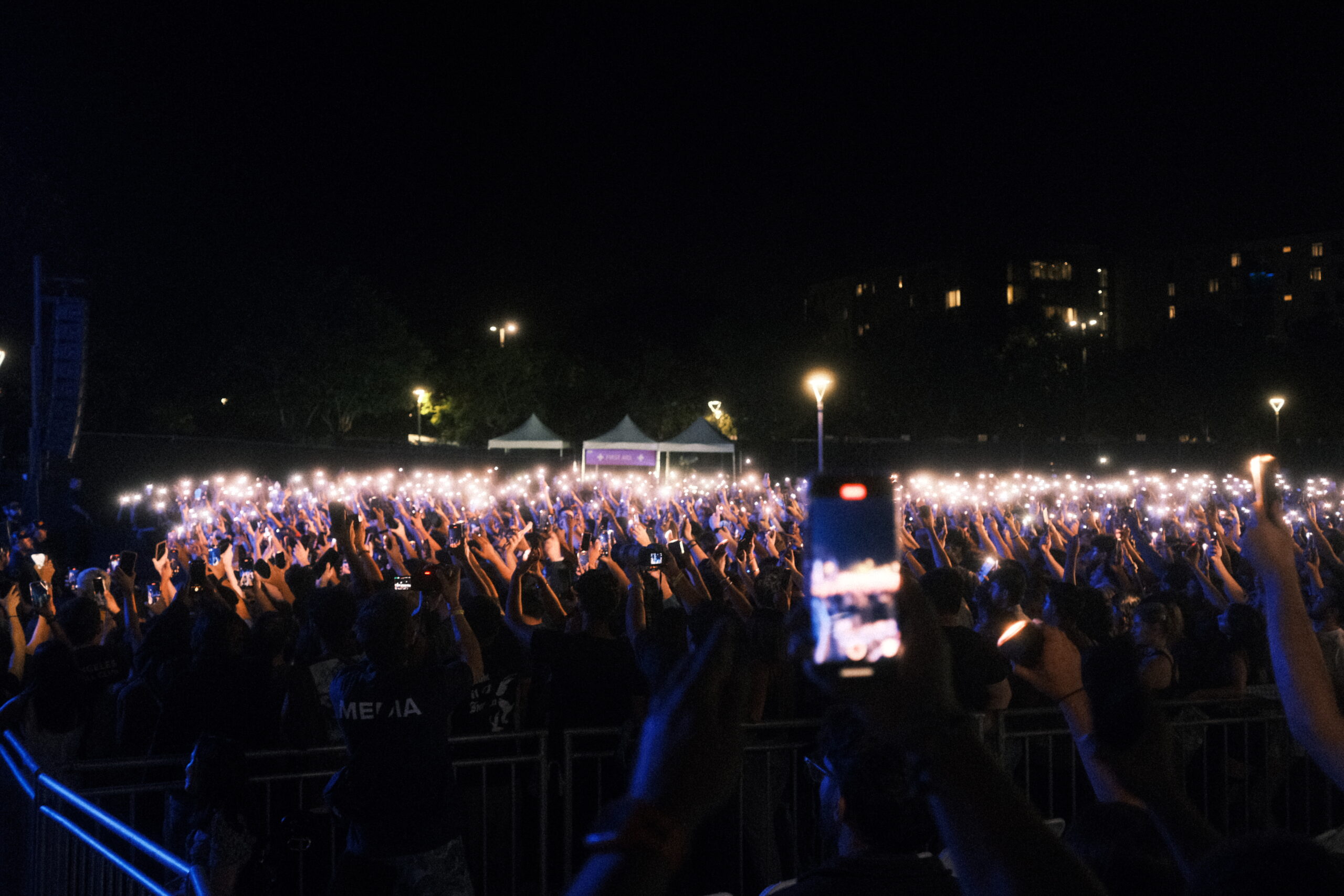 The crowd of thousands light up the night with the flashlights on their phones. Bryan Doan | The Poly Post